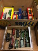 A box of unboxed Hornby locomotives and a box of boxed rolling stock