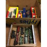 A box of unboxed Hornby locomotives and a box of boxed rolling stock