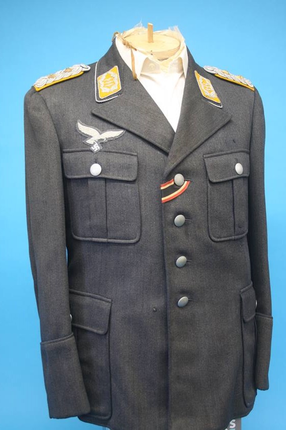 A Luftwaffe Colonel's tunic, with label E. Breuninger A.-G. Stuggart, Herr Karl Schmitt, No. E.A.