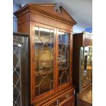 A reproduction walnut bookcase