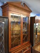 A reproduction walnut bookcase