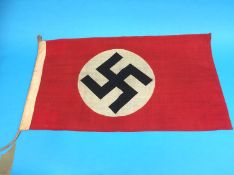 A small German flag, stamped Gusch, 0.5cm x 0.85cm