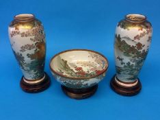 A pair of Japanese Satsuma vases and matching bowl