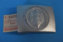 A Hitler Youth steel buckle, with paper label, numbered 333284