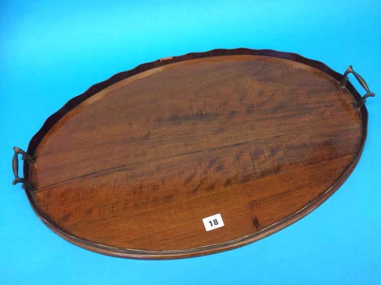 An oval Edwardian mahogany serving tray