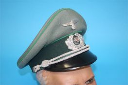 A German Jager (Light Infantry) Officer's visor cap, with green piping stamped Erel, Stirnschutz,