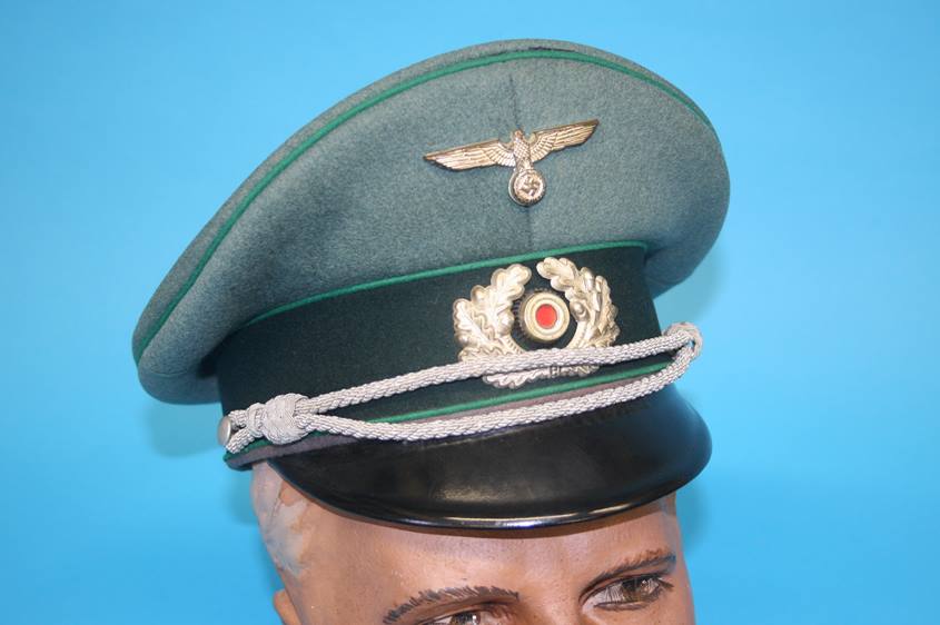 A Jager (Light Infantry) Officer's visor cap in light green, marked Pekuro, Stirndruckfrei Deutsches