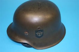 A German double decal tin helmet, stamped E.164