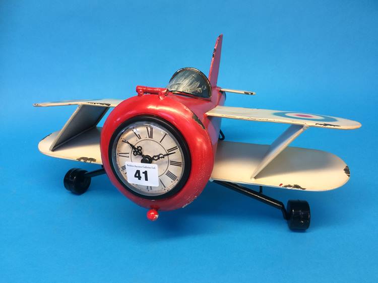 Novelty clock in the form of a Bi-Plane