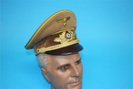 A German NSDAP Officer's visor cap, with gilt eagle, gilded aluminium oak leaf wreath and bearing