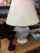 A Cranberry coloured lustre and a table lamp