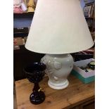 A Cranberry coloured lustre and a table lamp