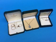 Three 9ct gold mounted pendants and necklaces