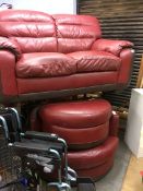 A leather two seater sofa and armchair