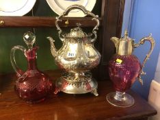 A silver plated kettle and stand and claret jug an