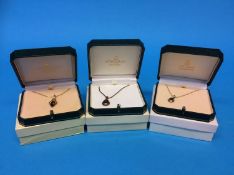 Three 9ct gold mounted pendants and necklaces