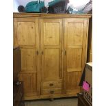 A pine triple door wardrobe