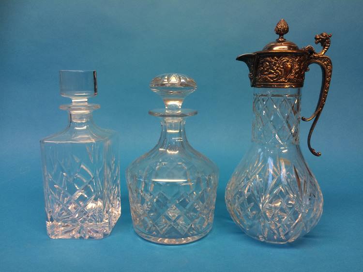 Two cut glass decanters and a claret jug