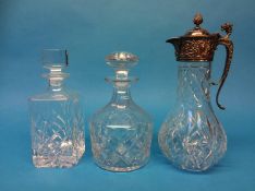 Two cut glass decanters and a claret jug