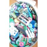 Tin of early buttons