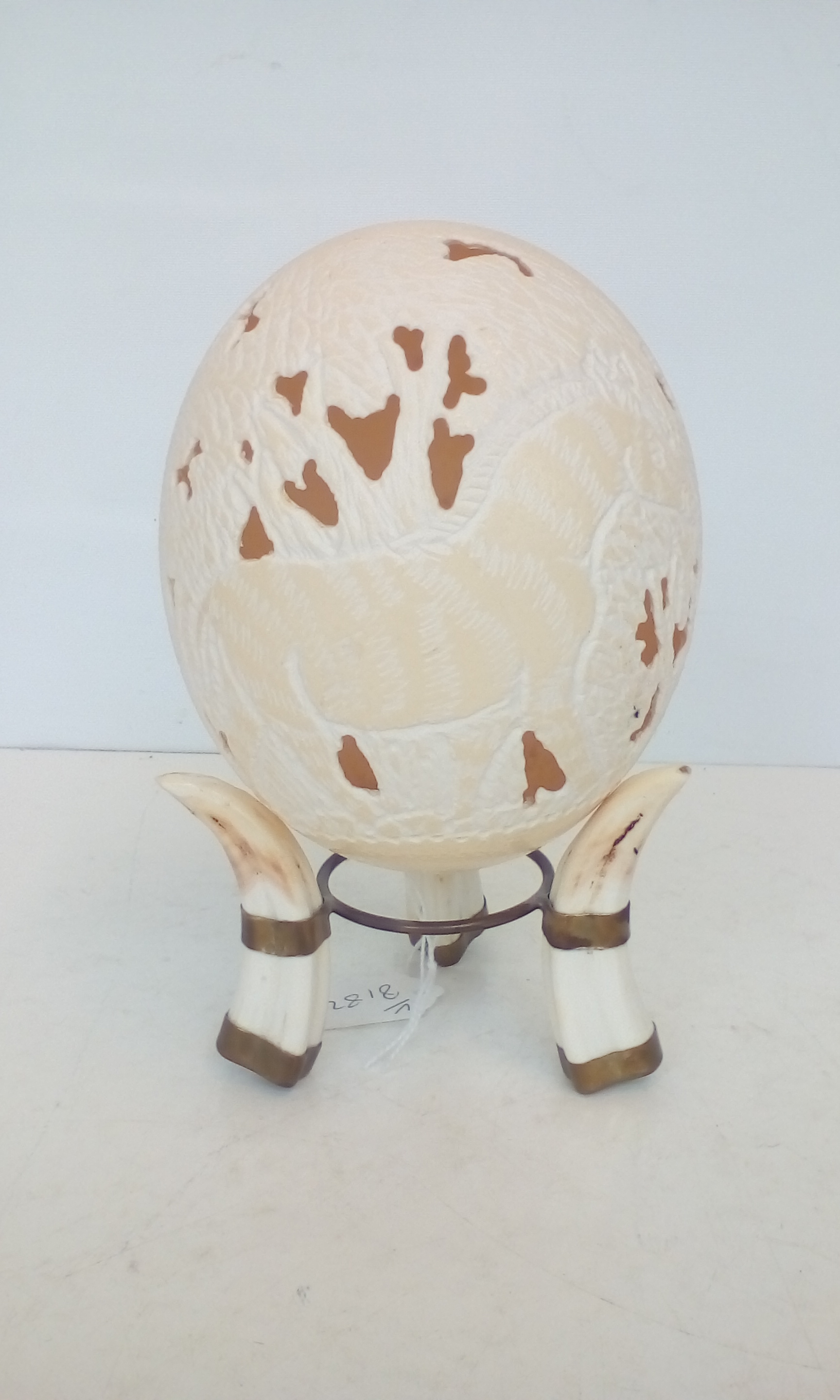 Ornate Ostrich egg on stand, height 22cm