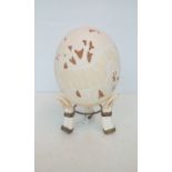 Ornate Ostrich egg on stand, height 22cm