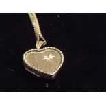 9ct gold locket and chain 5.8 grams