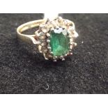 9ct gold dress ring with central green stone. Size