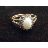 9ct gold dress ring with central opal. Size J