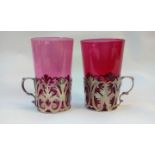 Two cranberry glasses with silver holders. Birming