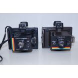 Two Polaroid cameras