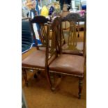 Set of four dining chairs with clam motif to top r