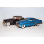 Pair of vintage mechanical tin plate cars length 3