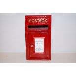 A red cast iron post box with key height- 44cm wid