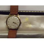 9ct gold gents wristwatch by Garrard and co in ori