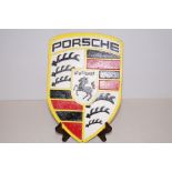 A cast iron Porsche sign