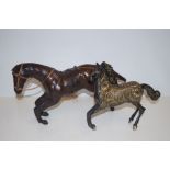 Leather figure of a horse together with a base met