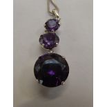 Silver necklace and pendant with purple gemstones