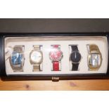 Cased group of five fashion watches, well presente