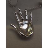 Silver chain and pendant in the form of a hand