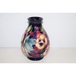 Moorcroft vase in the Fruit Feast, height 20cm