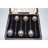 A cased set of silver bean spoons