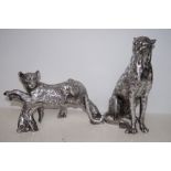 Two large silvered resin leopard figures, largest