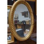 Oval guilt frame mirror