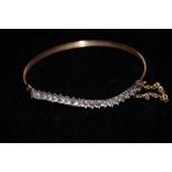 9ct gold bangle set with white stones