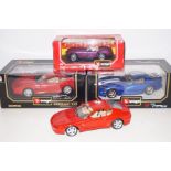 Four Burago model super cars, three being boxed