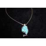 Silver necklace and pendant set with blue stone