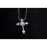 Silver necklace and cross shaped pendant set with