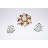 9 carat gold pin brooch set with opals and sapphir