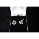 Pair of silver earrings set with amethyst stones